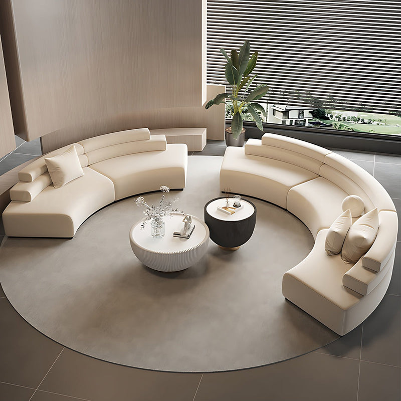 Elegant Minimalist Beige Curved Sofa Featuring Modular Configuration and Plush Backrest
